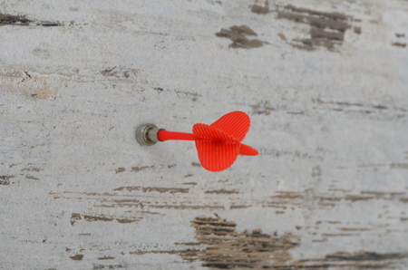 Magnetic darts arrow over a white woodの写真素材