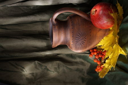 still life pitcher of pomegranate vitamin, snack, light, draperyの写真素材