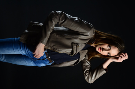 Fashion photo of beauty woman on dark backgroundの写真素材