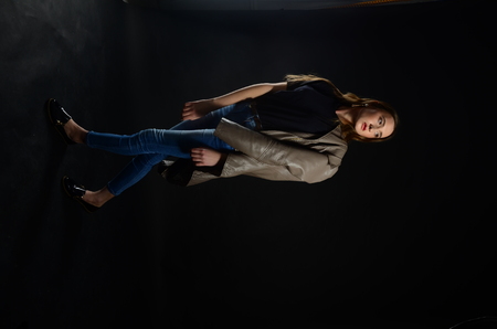 Fashion photo of beauty woman on dark backgroundの写真素材