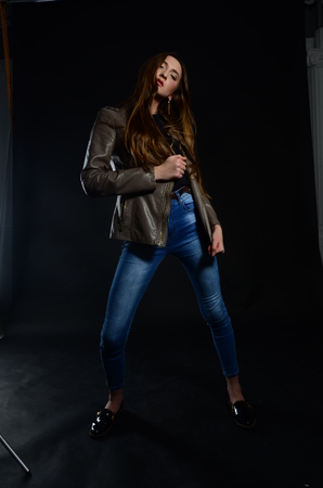 Fashion photo of beauty woman on dark backgroundの写真素材