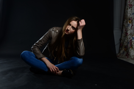 Fashion photo of beauty woman on dark backgroundの写真素材