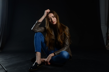 Fashion photo of beauty woman on dark backgroundの写真素材