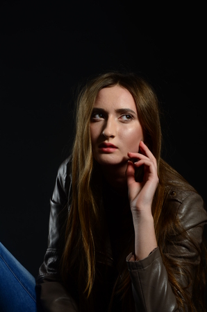 Fashion photo of beauty woman on dark backgroundの写真素材