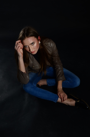 Fashion photo of beauty woman on dark backgroundの写真素材