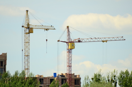 Construction of the new building tower craneの写真素材