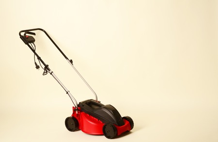 Lawnmower Isolated on White Background. Gas Lawn Mower. Red Grass-Cutter. Garden Equipment. Garden Power Tools.の写真素材