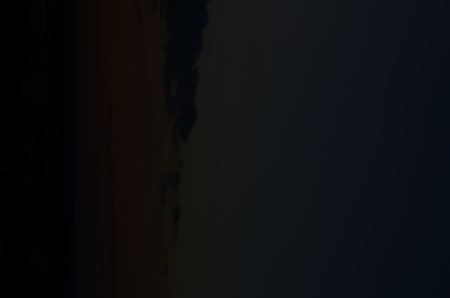 Sunset silhouette of church cross at sunsetの写真素材