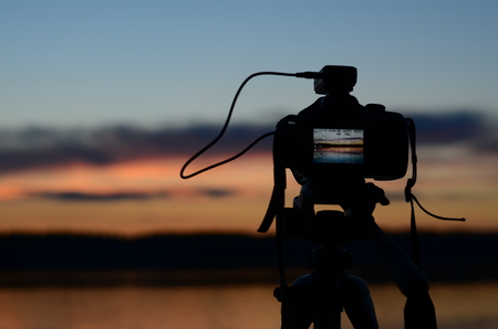 Beautiful sunset reflected in the lakeの写真素材