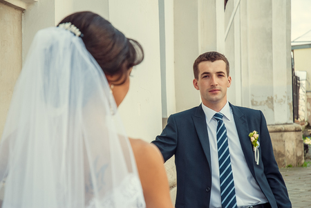 Ukraine, Lutsk - 09.08.2014: the Wedding ceremony. Lovers of nature walks in Park. Beautiful delicate and romantic couples, loving each other. Editorial reportage typical wedding.のeditorial素材
