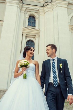 Ukraine, Lutsk - 09.08.2014: the Wedding ceremony. Lovers of nature walks in Park. Beautiful delicate and romantic couples, loving each other. Editorial reportage typical wedding.のeditorial素材