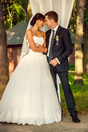 Ukraine, Lutsk - 09.08.2014: the Wedding ceremony. Lovers of nature walks in Park. Beautiful delicate and romantic couples, loving each other. Editorial reportage typical wedding.のeditorial素材