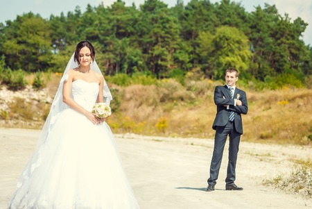Ukraine, Lutsk - 09.08.2014: the Wedding ceremony. Lovers of nature walks in Park. Beautiful delicate and romantic couples, loving each other. Editorial reportage typical wedding.のeditorial素材