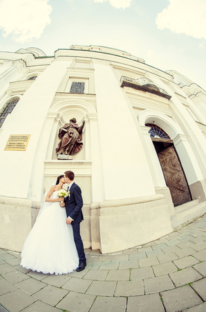 Ukraine, Lutsk - 09.08.2014: the Wedding ceremony. Lovers of nature walks in Park. Beautiful delicate and romantic couples, loving each other. Editorial reportage typical wedding.のeditorial素材