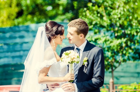 Ukraine, Lutsk - 09.08.2014: the Wedding ceremony. Lovers of nature walks in Park. Beautiful delicate and romantic couples, loving each other. Editorial reportage typical wedding.のeditorial素材