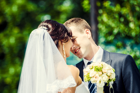 Ukraine, Lutsk - 09.08.2014: the Wedding ceremony. Lovers of nature walks in Park. Beautiful delicate and romantic couples, loving each other. Editorial reportage typical wedding.のeditorial素材