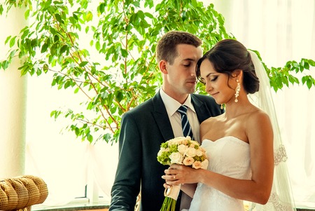 Ukraine, Lutsk - 09.08.2014: the Wedding ceremony. Lovers of nature walks in Park. Beautiful delicate and romantic couples, loving each other. Editorial reportage typical wedding.のeditorial素材