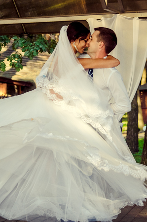 Ukraine, Lutsk - 09.08.2014: the Wedding ceremony. Lovers of nature walks in Park. Beautiful delicate and romantic couples, loving each other. Editorial reportage typical wedding.のeditorial素材