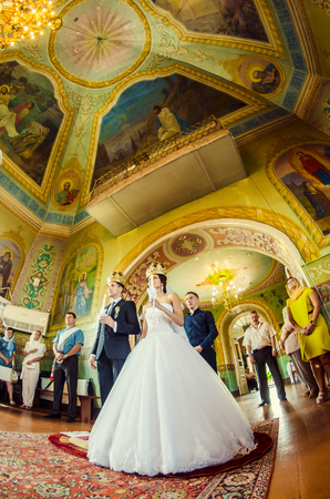 Ukraine, Lutsk - 09.08.2014: the Wedding ceremony. Lovers of nature walks in Park. Beautiful delicate and romantic couples, loving each other. Editorial reportage typical wedding.のeditorial素材