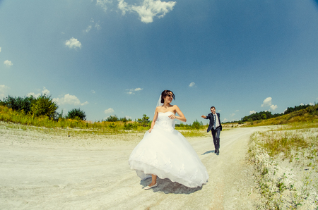 Ukraine, Lutsk - 09.08.2014: the Wedding ceremony. Lovers of nature walks in Park. Beautiful delicate and romantic couples, loving each other. Editorial reportage typical wedding.のeditorial素材