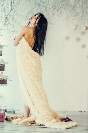 Beautiful Brunette on the Background of New Years decoration. Fashion Beauty Portrait. Sexy Girlの写真素材