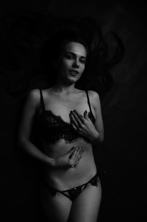 Young beautiful woman in a fashionable linen luxury brunette in the Studioの写真素材