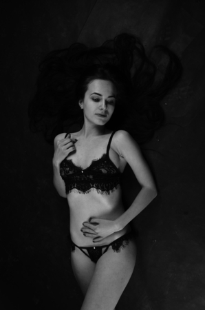 Young beautiful woman in a fashionable linen luxury brunette in the Studioの写真素材