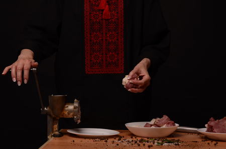 Woman stirring cooked minced meat in kitchen.の写真素材