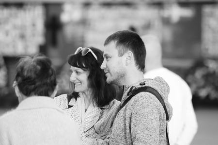 travel couple walking around city on vacation with guide book having fun Lutsk Ukraine 20.04.2018のeditorial素材