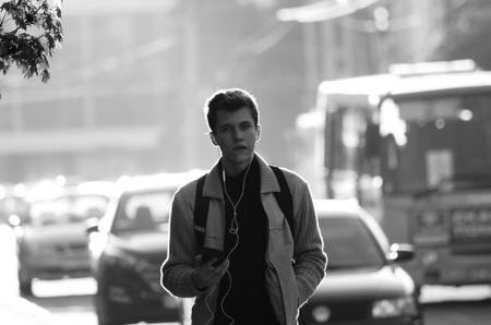 travel couple walking around city on vacation with guide book having fun Lutsk Ukraine 20.04.2018のeditorial素材