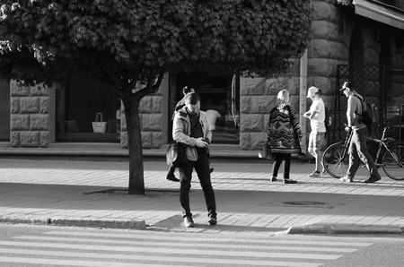 travel couple walking around city on vacation with guide book having fun Lutsk Ukraine 20.04.2018
