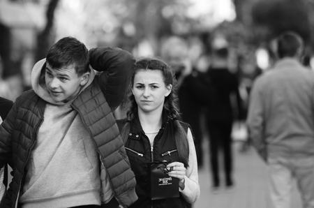 travel couple walking around city on vacation with guide book having fun Lutsk Ukraine 20.04.2018のeditorial素材