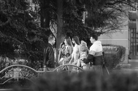 Full length of a smiling couple walking on sidewalk Lutsk Ukraine 20.04.2018.のeditorial素材