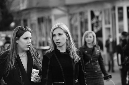 Full length of a smiling couple walking on sidewalk Lutsk Ukraine 20.04.2018.のeditorial素材