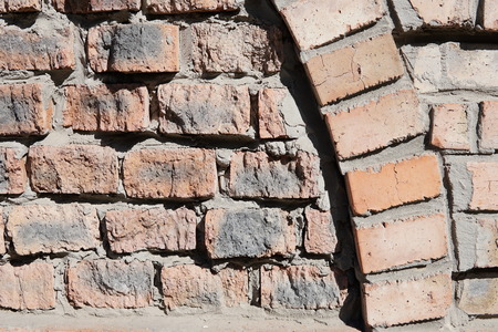 brick wall of red color, wide panorama of masonry.
