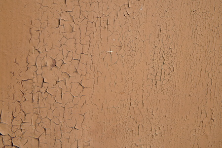 Cracking and peeling paint on a wall.の写真素材