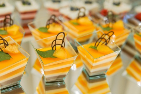 kendi bar on children's birthday. cake with unicorn and sweets, ornaments in gentle pastel tones.の写真素材