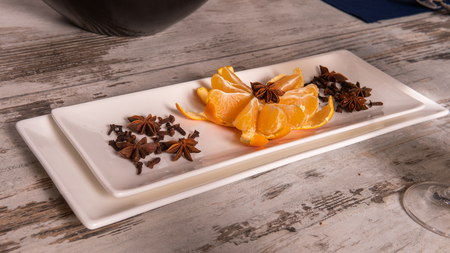 Rustic table setting with pink flowers and candle on light wooden table. Holidays decoration on Provence style. Romantic dinner. Overhead.の写真素材
