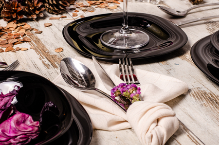 Beautiful table setting with lavender flowers on wooden background.の写真素材