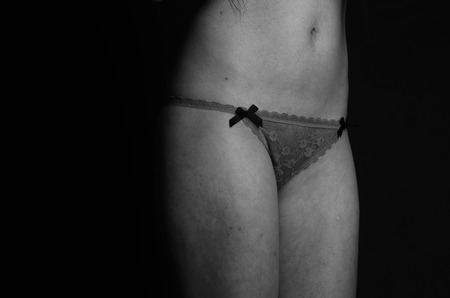 Young beautiful woman in a fashionable linen luxury brunette in the Studioの写真素材