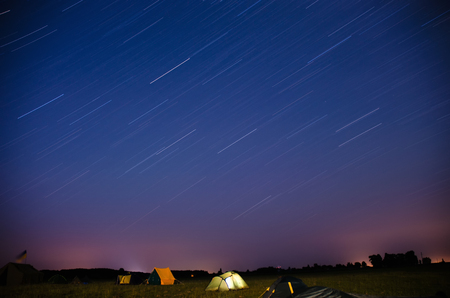 Camping in the night with tracer Stars