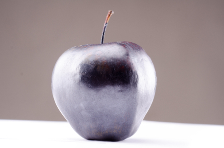colored apple isolated on white background reflectionの写真素材
