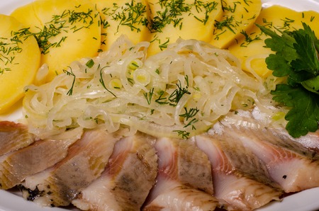 Salted Fish with Boiled Potato and Pickled Onions.の写真素材