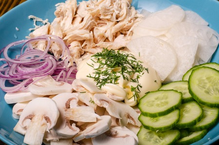 Fresh summer salad with vegetables - tomatoes, garlic, spinach, mushrooms, radish, cabbage, carrot, greens. Vitamins for kids. Vegan, vegetarian healthy food conceptの写真素材