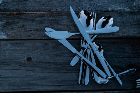 knife and fork on wooden background. Cutlery on woodenの写真素材