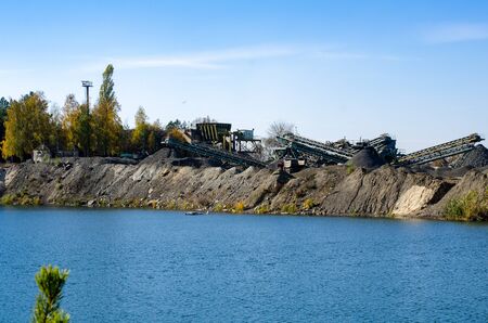 Mobile Stone crusher machine by the construction site or mining quarry for crushing old concrete...
