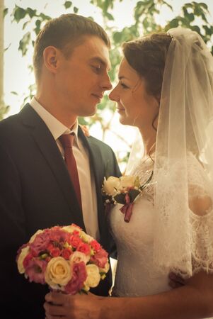 Ukraine, Lutsk - 27.10.2013: the Wedding ceremony. Lovers of nature walks in Park. Beautiful delicate and romantic couples, loving each other. Editorial reportage typical wedding.のeditorial素材