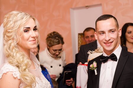 Bride and Groom at wedding Day walking Outdoors on spring nature. Bridal couple, Happy Newlywed woman and man embracing in green park. Loving wedding couple outdoor. 12.03.18 lutsk, Ukraine.のeditorial素材