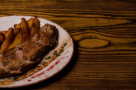 Meat balls with potatoes in a baking dish and sour cream close-up on a table. horizontal view from above.の写真素材