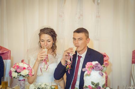 Ukraine, Lutsk - 27.10.2013: the Wedding ceremony. Lovers of nature walks in Park. Beautiful delicate and romantic couples, loving each other. Editorial reportage typical wedding.のeditorial素材